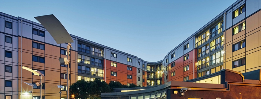 Large student residence building in the evening